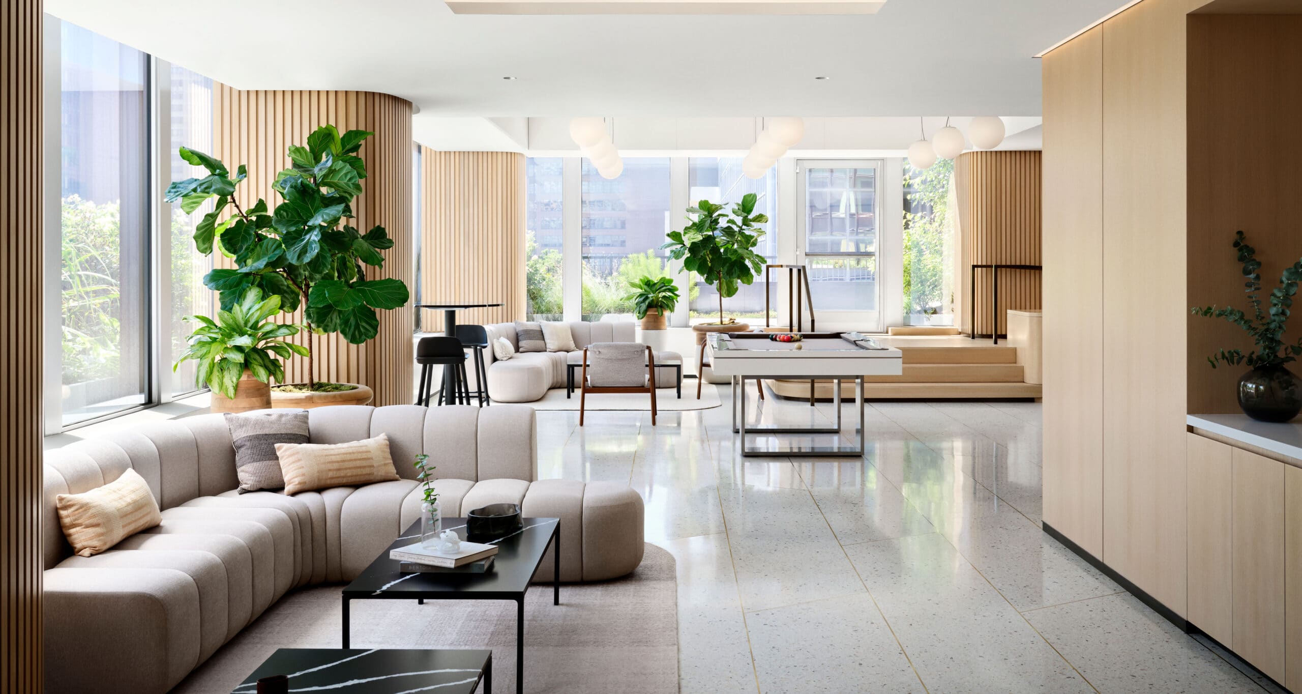 Biophilic exterior and interior plant design with greenery and natural elements integrated into a commercial space.